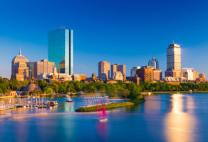 A city skyline with boats in the water.